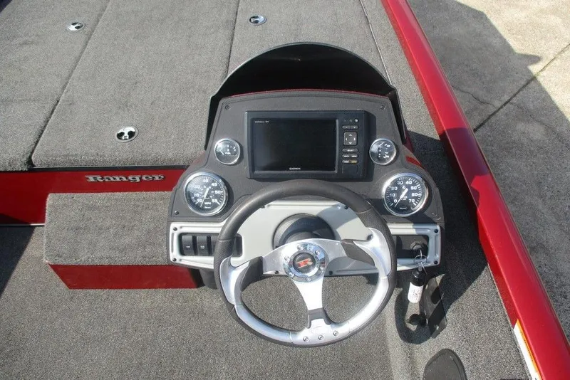 Slide: The Image of 2026 Ranger RT188 boat dashboard with steering wheel and gauges. - 2