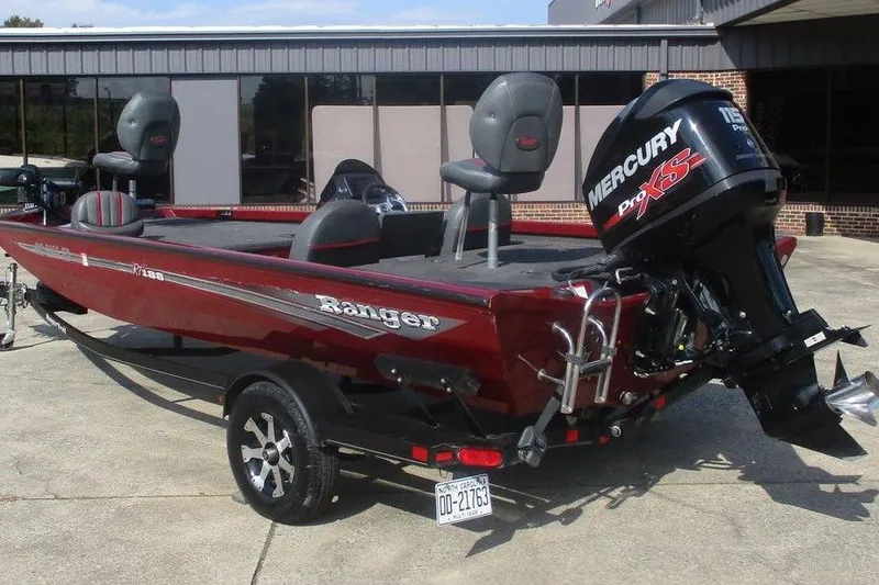 Slide: The Image of 2026 Ranger RT188 boat with Mercury Pro XS engine, parked outdoors. - 4