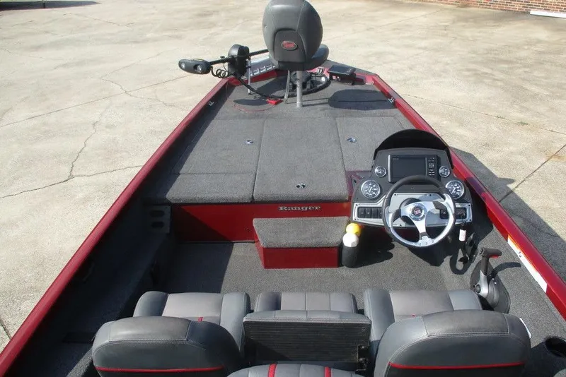 Slide: The Image of 2026 Ranger RT188 boat interior with steering console and seating, featuring a sleek design. - 7