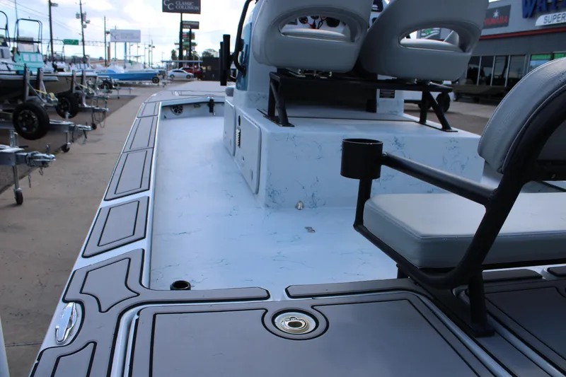 Slide: The Image of 2024 Shoalwater 23 Catamaran boat interior with seating and deck details. - 6