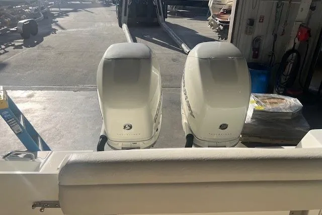 Slide: The Image of 2017 Boston Whaler 280 Outrage boat detail, showcasing model name on white exterior. - 26