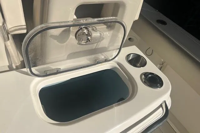 Slide: The Image of 2017 Boston Whaler 280 Outrage boat interior with seating and console. - 27