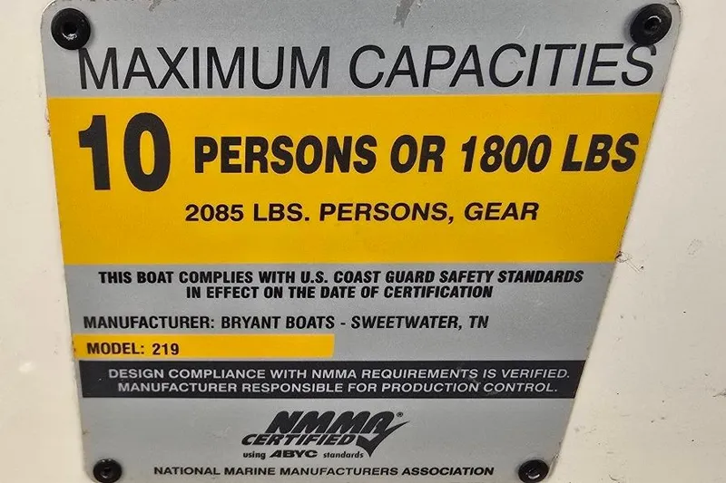 Slide: The Image of 2007 Bryant 219 BR boat capacity label: 10 persons or 1800 lbs, NMMA certified. - 20