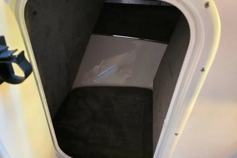 Slide: The Image of Interior storage compartment of a 2007 Bryant 219 BR boat. - 24