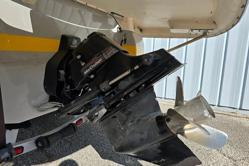 Slide: The Image of 2007 Bryant 219 BR boat rear view with propeller and trailer. - 11