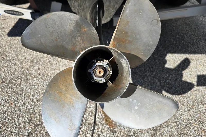 Slide: The Image of Close-up of a 2007 Bryant 219 BR boat's MerCruiser outdrive and propeller. - 12