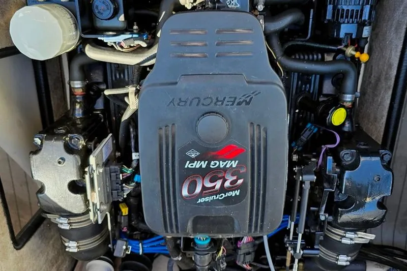 Slide: The Image of Close-up of a 2007 Bryant 219 BR boat propeller on a gravel surface. - 13