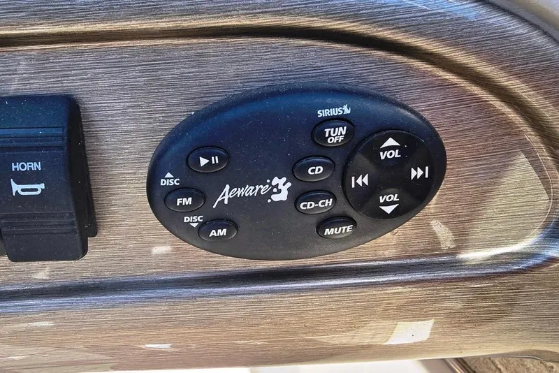 Slide: The Image of Steering console of a 2007 Bryant 219 BR boat with gauges and controls. - 15