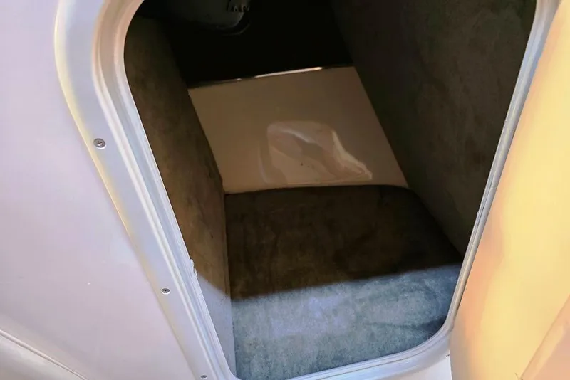 Slide: The Image of Interior storage compartment of a 2007 Bryant 219 BR boat. - 25
