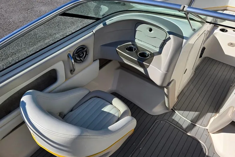 Slide: The Image of Interior of a 2007 Bryant 219 BR boat with seating and cup holders. - 3