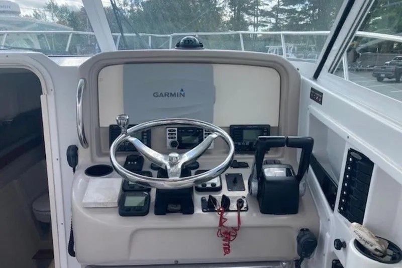 Slide: The Image of Helm of 2008 Glacier Bay 2685 Coastal Runner with Garmin navigation system. - 12