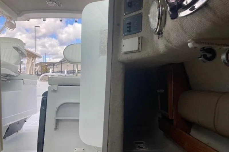 Slide: The Image of Interior view of 2008 Glacier Bay 2685 Coastal Runner boat, showcasing seating and control panel. - 2