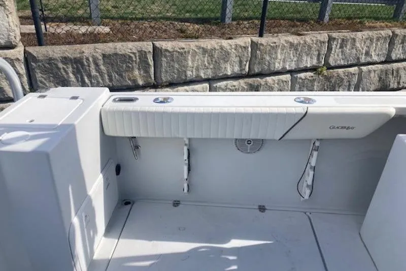 Slide: The Image of 2008 Glacier Bay 2685 Coastal Runner boat interior with seating and storage. - 7