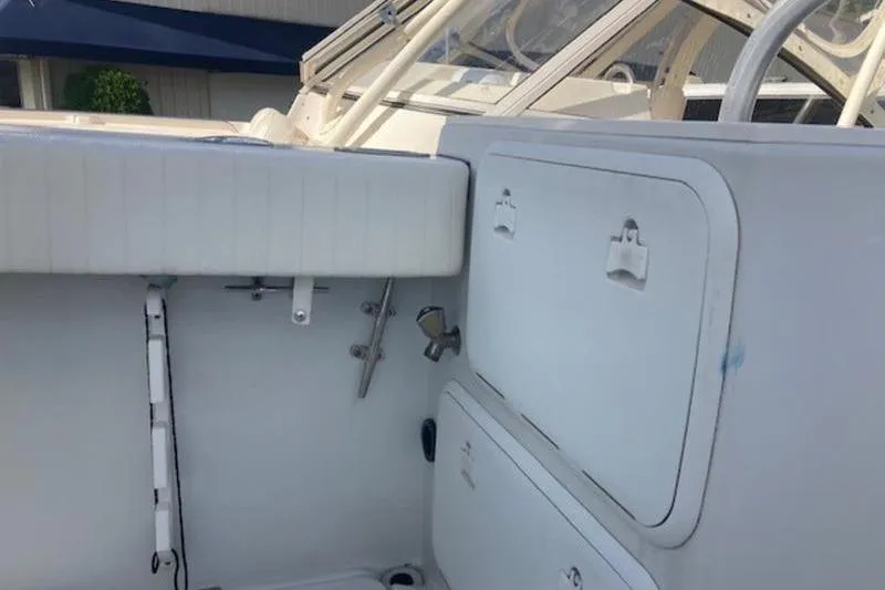 Slide: The Image of 2008 Glacier Bay 2685 Coastal Runner boat interior with storage compartments. - 9
