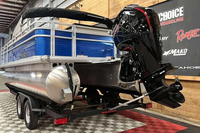 Slide: The Image of 2026 Sun Tracker Fishin' Barge 20 DLX pontoon boat with powerful outboard motor. - 8