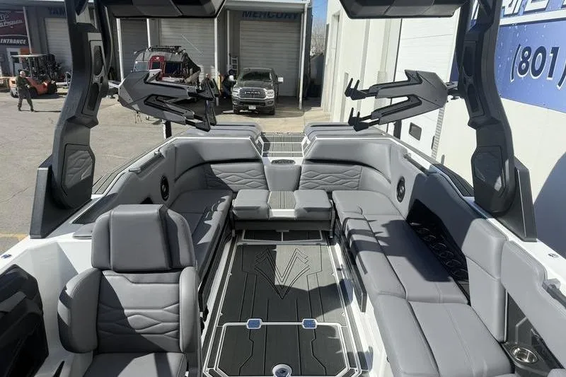 Slide: The Image of 2025 Supra SE 575 boat interior with luxurious gray seating and modern design. - 11