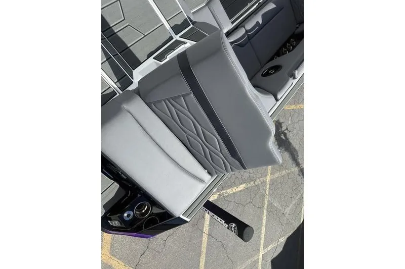 Slide: The Image of 2025 Supra SE 575 interior with gray quilted seats and modern design elements. - 12