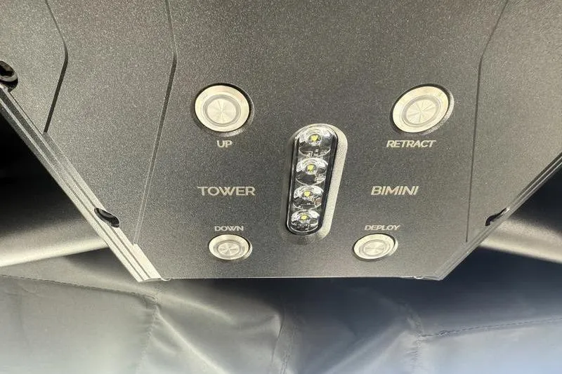 Slide: The Image of Control panel of 2025 Supra SE 575 boat with tower and bimini buttons. - 13