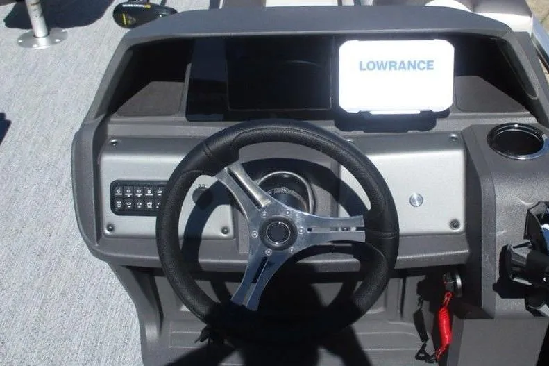 Slide: The Image of Steering console of 2026 Sun Tracker Fishin' Barge 20 DLX with Lowrance display. - 5