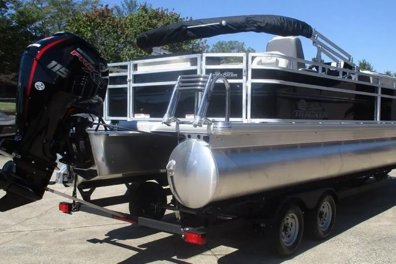 Slide: The Image of 2026 Sun Tracker Fishin' Barge 20 DLX pontoon boat on trailer, rear view. - 7