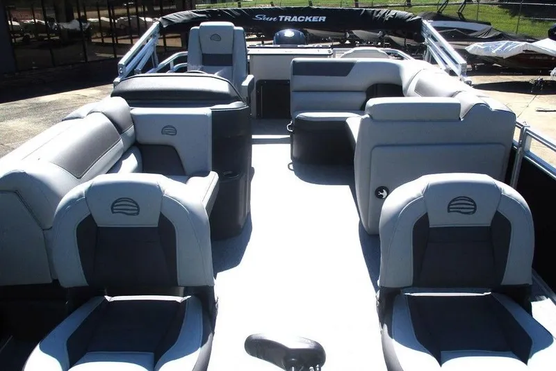 Slide: The Image of 2026 Sun Tracker Fishin' Barge 20 DLX interior with spacious seating and modern design. - 9
