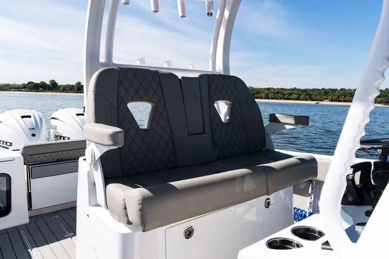 Slide: The Image of 2024 Sportsman Open 322 Center Console boat interior with steering and controls. - 19