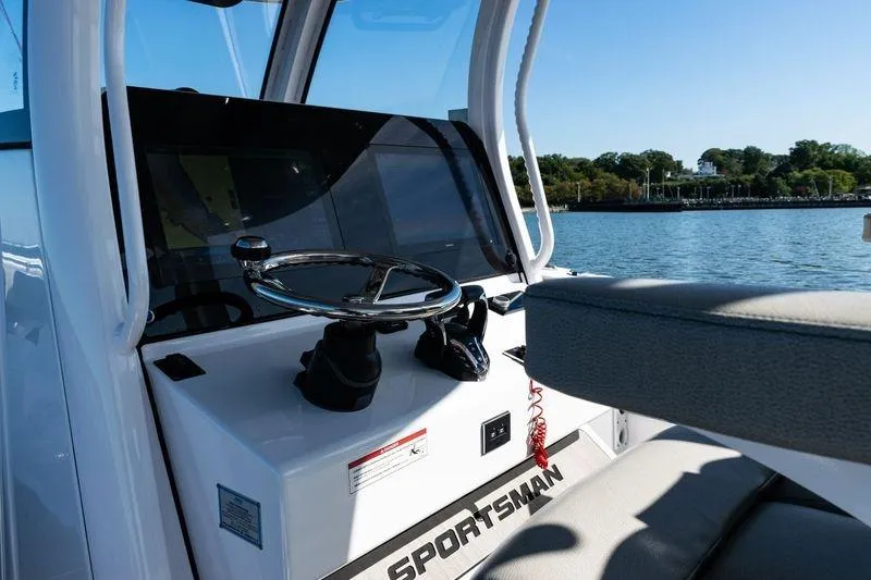 Slide: The Image of 2024 Sportsman Open 322 Center Console dashboard with navigation screens and controls. - 21
