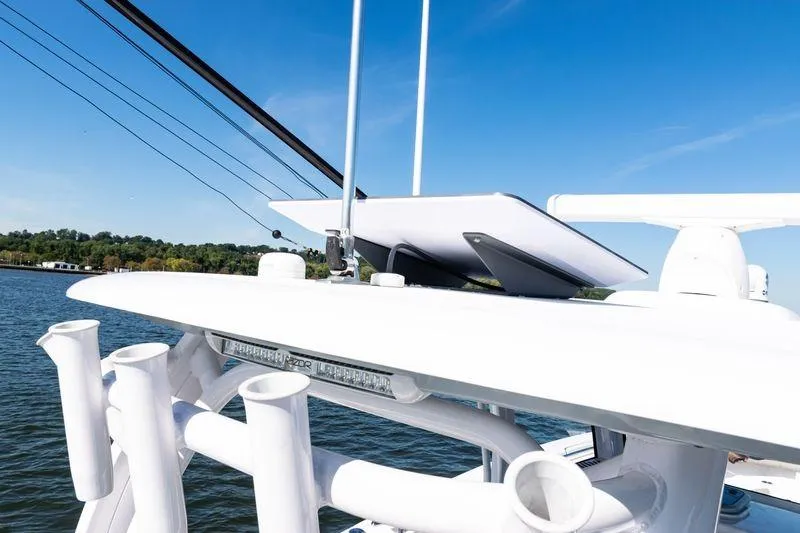 Slide: The Image of 2024 Sportsman Open 322 Center Console boat interior with Garmin electronics and speakers. - 30