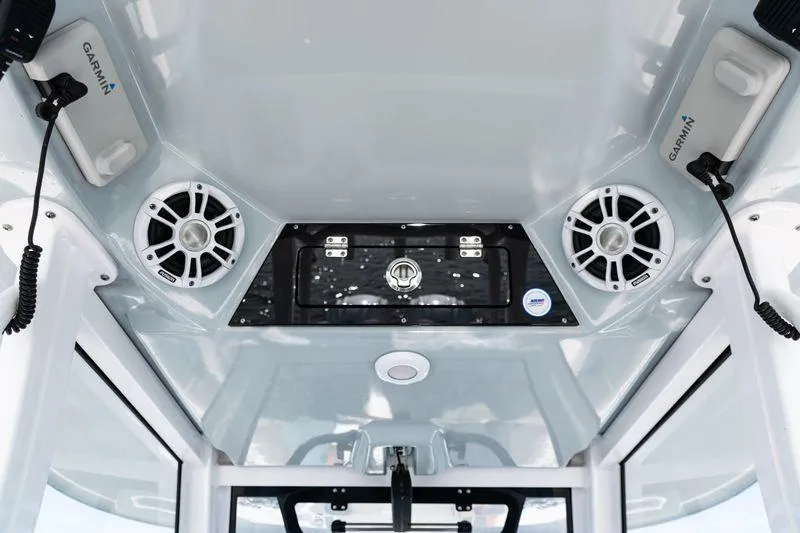 Slide: The Image of 2024 Sportsman Open 322 Center Console helm with advanced navigation displays. - 31