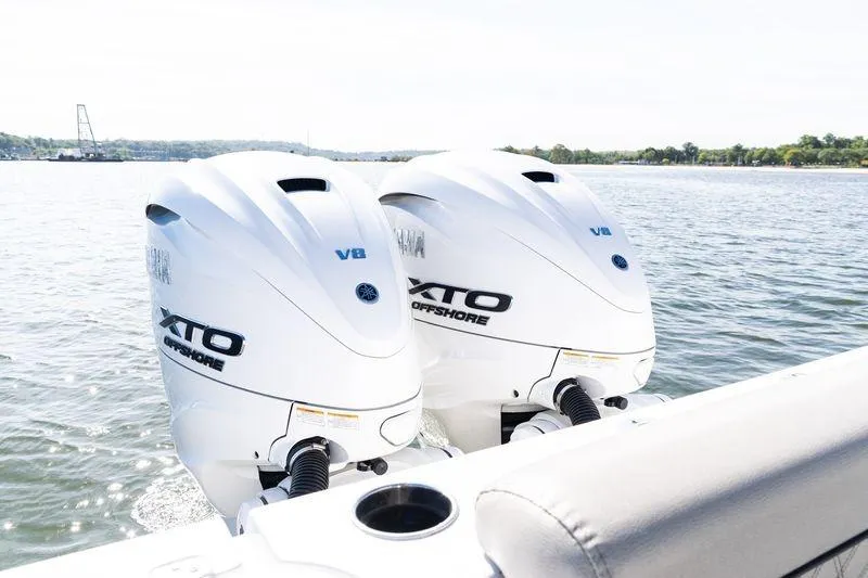 Slide: The Image of 2024 Sportsman Open 322 Center Console boat interior with coiled blue hose. - 33