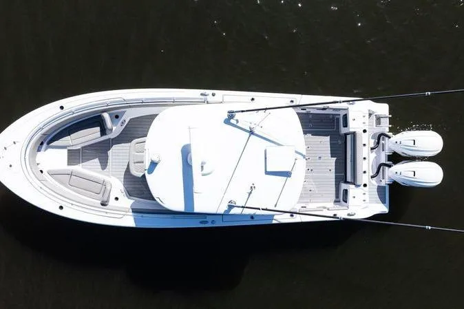 Slide: The Image of 2024 Sportsman Open 322 Center Console boat, aerial view on dark water. - 6