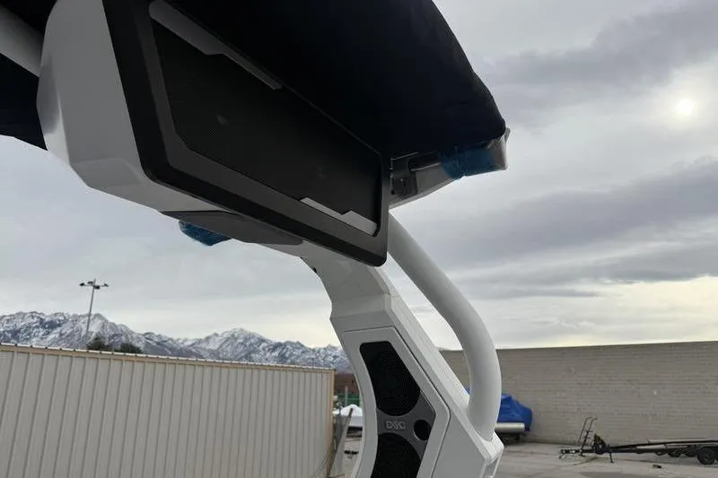 Slide: The Image of 2025 Supra SE 575 boat speaker system with mountain backdrop. - 12
