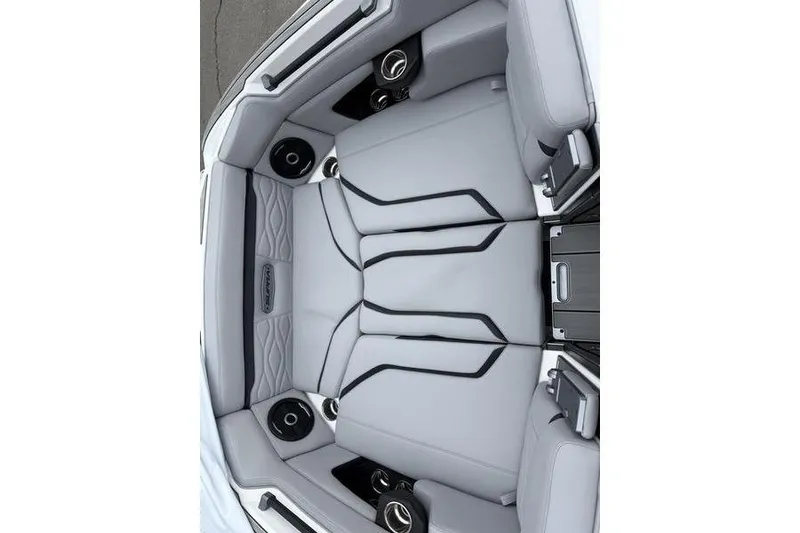 Slide: The Image of 2025 Supra SE 575 interior with sleek gray seating and integrated speakers. - 14