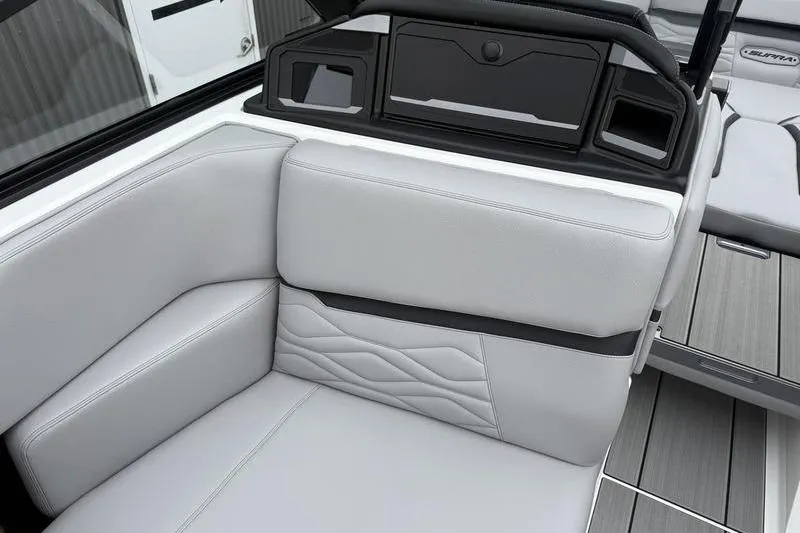 Slide: The Image of 2025 Supra SE 575 boat interior with sleek, modern seating and elegant design. - 7