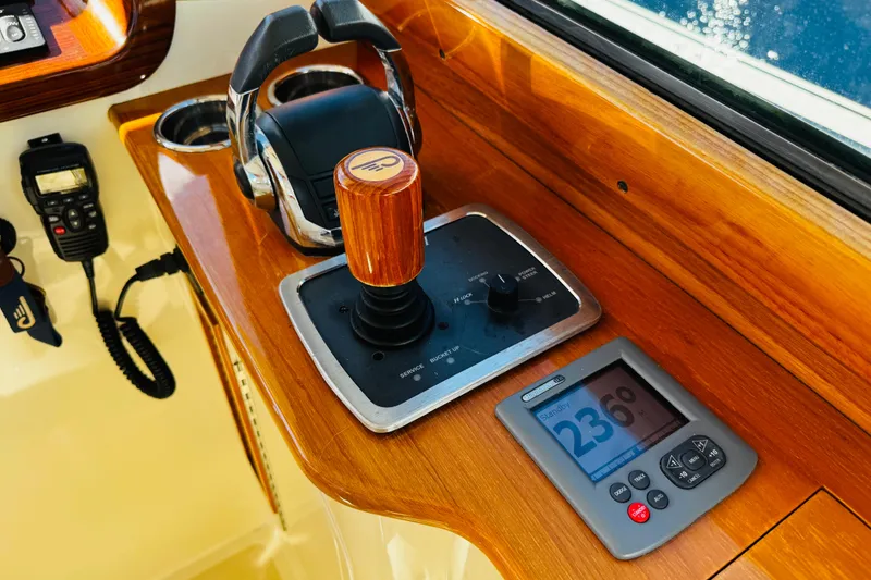 Slide: The Image of Control panel of 2012 Hinckley Picnic Boat MKIII with joystick and display. - 24