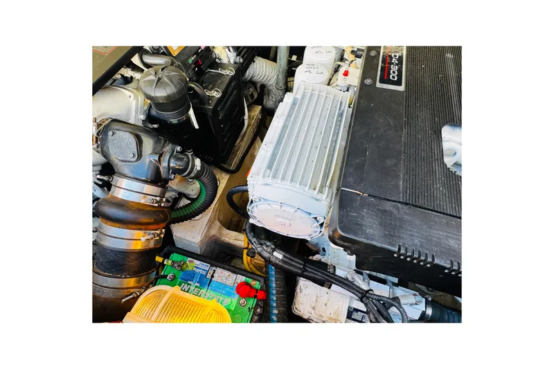 Slide: The Image of Engine compartment of a 2012 Hinckley Picnic Boat MKIII, showcasing mechanical components. - 51