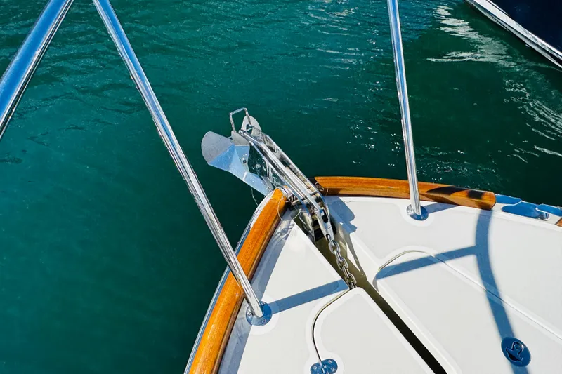 Slide: The Image of Bow of 2012 Hinckley Picnic Boat MKIII with anchor and teak accents. - 54