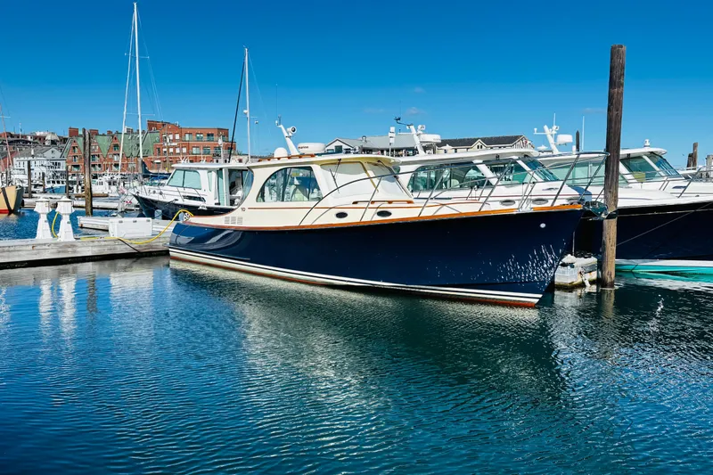 The Image of Hinckley Picnic Boat MKIII 2012 docked in a marina under clear blue skies. - 0