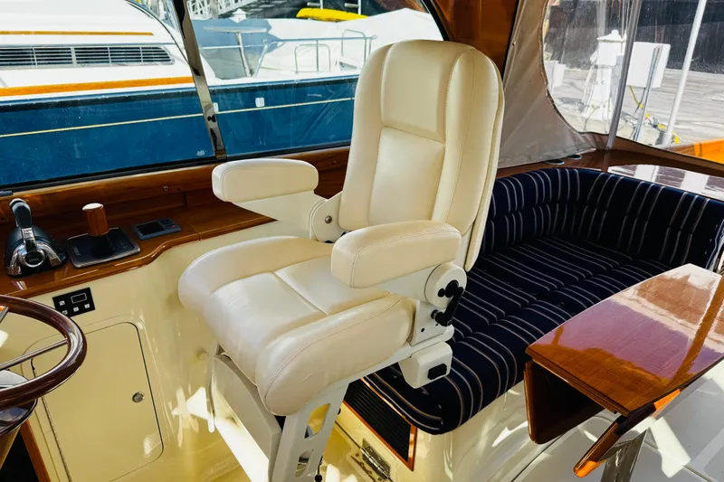 Slide: The Image of Luxurious helm seat and controls in 2012 Hinckley Picnic Boat MKIII. - 27