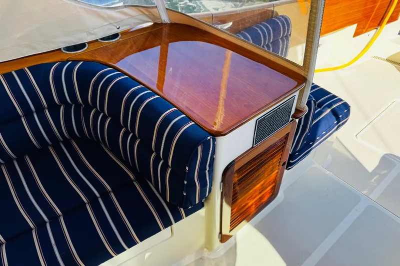 Slide: The Image of Luxurious interior of 2012 Hinckley Picnic Boat MKIII with striped seating and polished wood finish. - 33