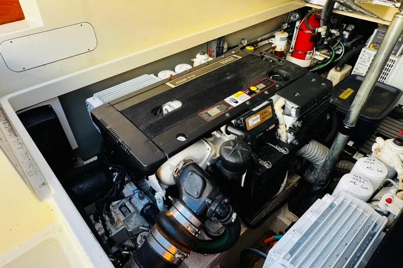 Slide: The Image of Engine compartment of a 2012 Hinckley Picnic Boat MKIII, showcasing detailed mechanical components. - 49