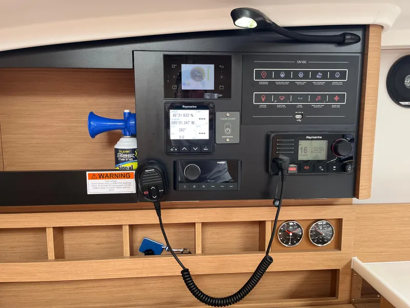 Slide: The Image of Control panel of 2024 Jeanneau Sun Odyssey 410 sailboat with navigation and communication equipment. - 23