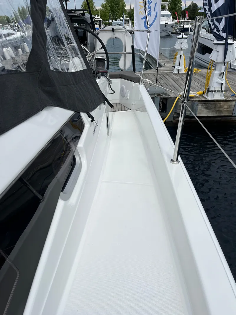 Slide: The Image of 2024 Jeanneau Sun Odyssey 410 sailboat deck view at marina. - 6