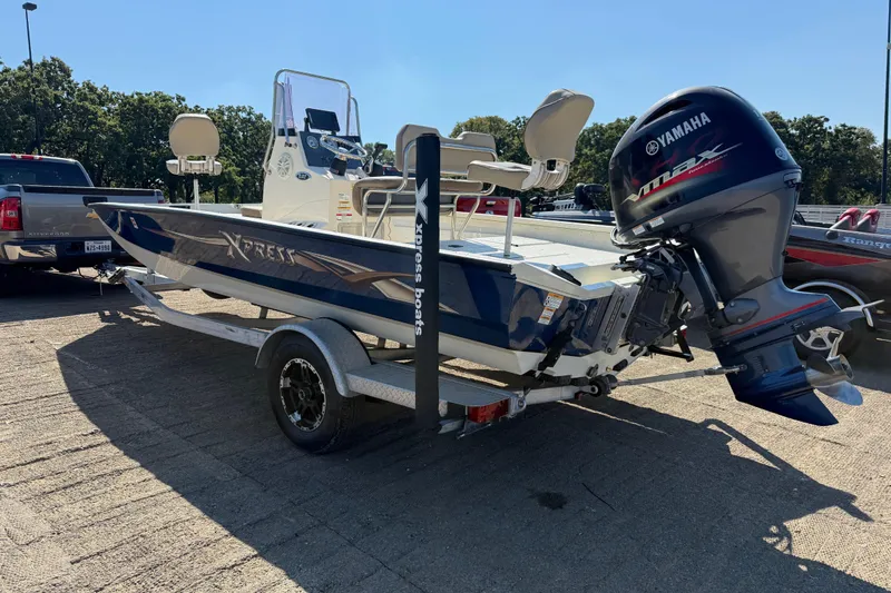 Slide: The Image of 2018 Xpress H20B Bay boat on trailer with Yamaha outboard motor. - 36