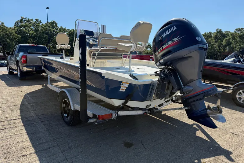 Slide: The Image of 2018 Xpress H20B Bay boat with Yamaha outboard motor on trailer. - 37