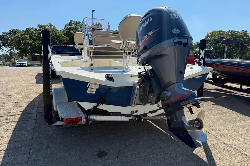 Slide: The Image of 2018 Xpress H20B Bay boat with Yamaha outboard motor on trailer. - 38
