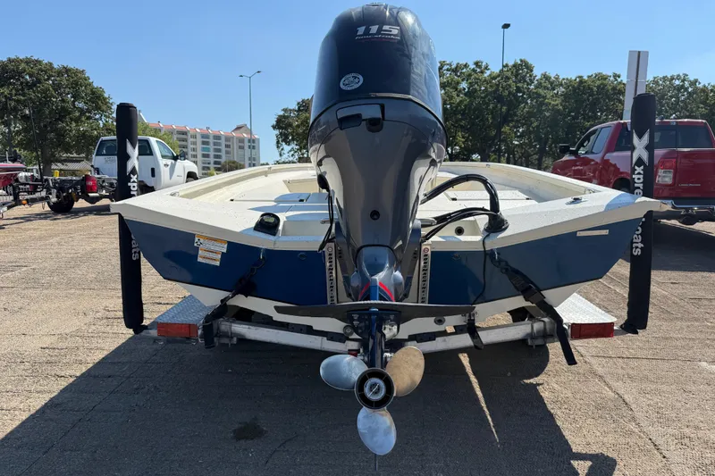 Slide: The Image of 2018 Xpress H20B Bay boat on trailer, rear view with outboard motor. - 39