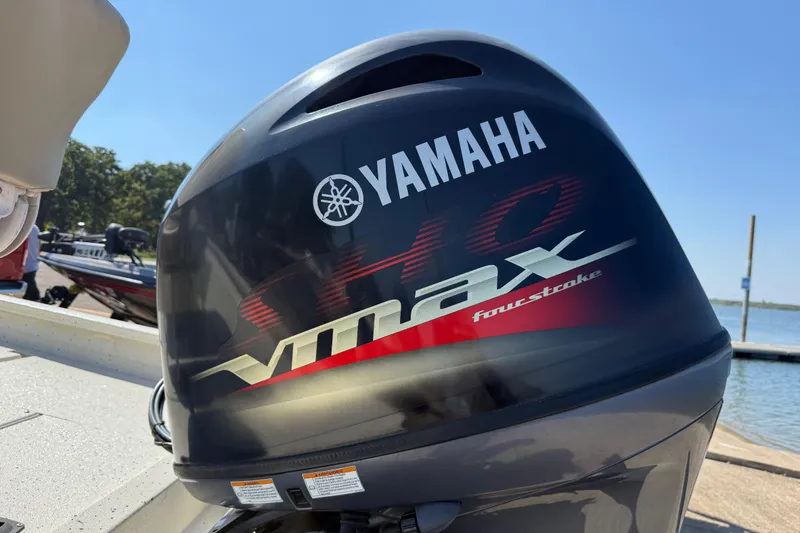 Slide: The Image of Yamaha VMAX four-stroke engine on 2018 Xpress H20B Bay boat by the water. - 40