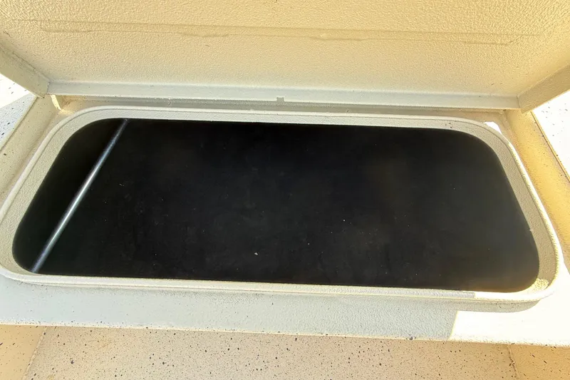 Slide: The Image of Open storage compartment in 2018 Xpress H20B Bay boat. - 53