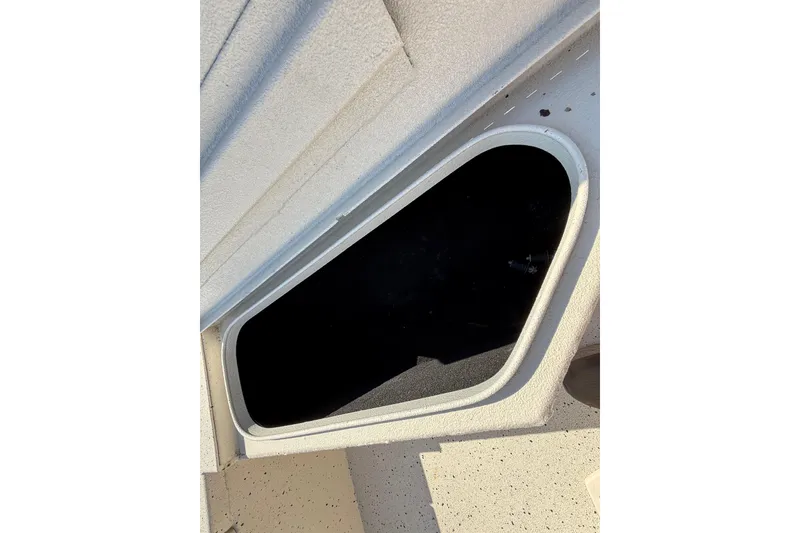 Slide: The Image of 2018 Xpress H20B Bay boat storage compartment, open hatch view. - 55